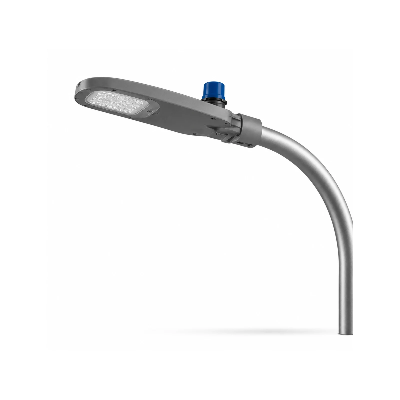 AC LED street light head mounted on a pole arm over a road